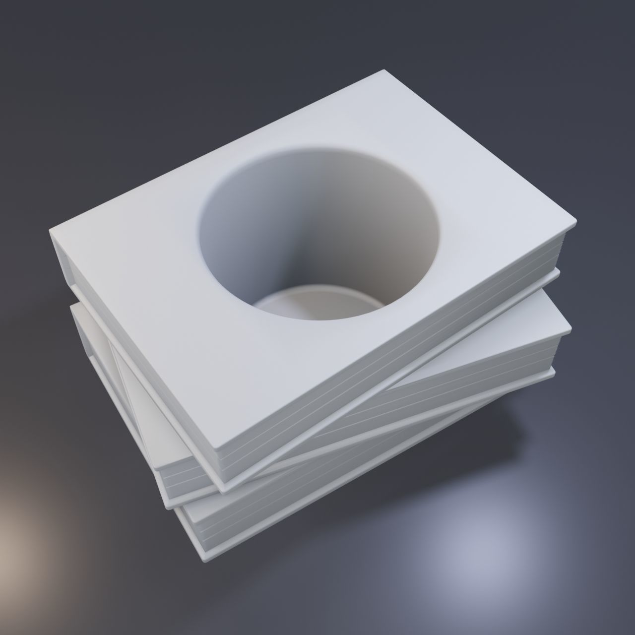 Three books with a hole